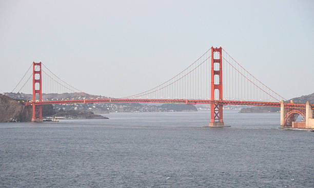 мост золотые ворота-закате - golden gate bridge car san francisco bay san francisco county стоковые фото и изображения