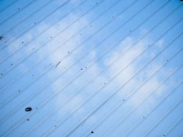 istock double exposure roof and cloudscape blue sky on sunny day 495646912