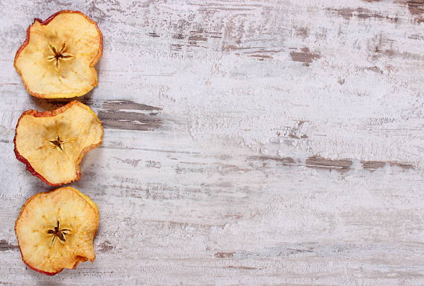 istock Dried apple on wooden background, copy space for text 495647190
