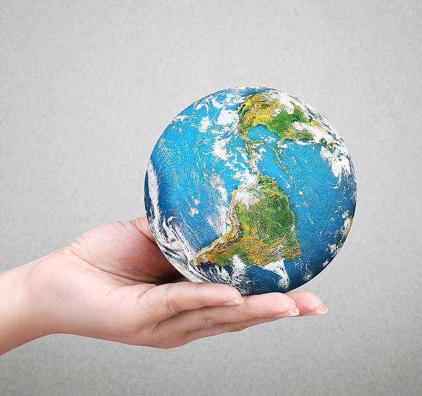 istock Human hand holding  globe  Elements of  image furnished by NASA 495648974