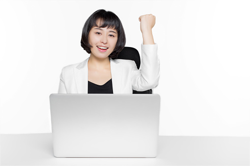 happy female business man working with laptop In office