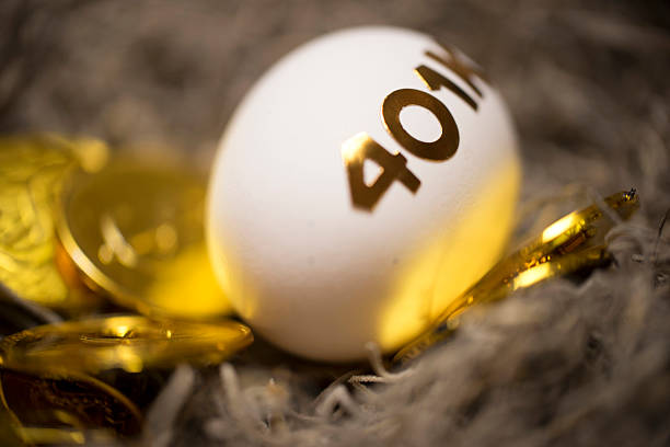 Nest egg with 401k studio shot of an egg with word 401k precious metals roth ira stock pictures, royalty-free photos & images