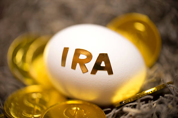 nest egg studio shot of an egg with word gold gold ira companies gold stock pictures, royalty-free photos & images
