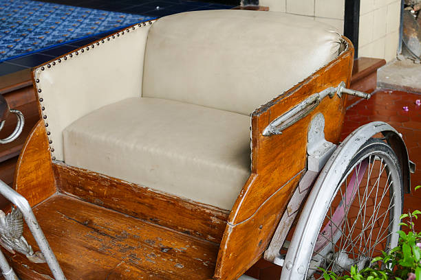 old classic traditional asian tricycle with beige leather cushion
