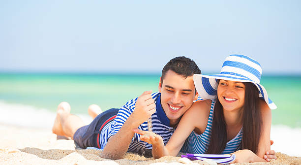 istock Young students in love on the beach. 495653783