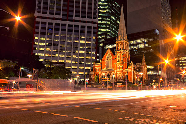 Albert Street Uniting Church surrounded by skyscrapers in Brisbane, Queensland, Australia.