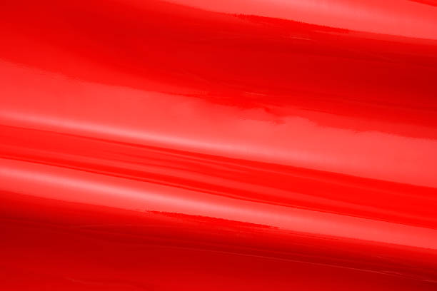 istock Close-up of red shiny vinyl wave texture background 495655201