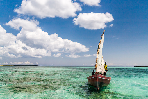Pointe Bambou, Grand Sable, Mauritius: fishermen sailing in a traditional Mauritian pirogue in the calm waters protected by the reef - B28 coastal road - Flacq-Mahebourg royal road.