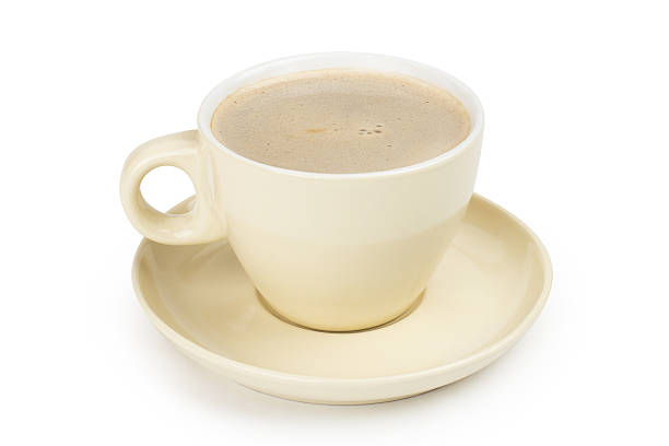 istock small white cup of cappuccino coffee on light background 495660018