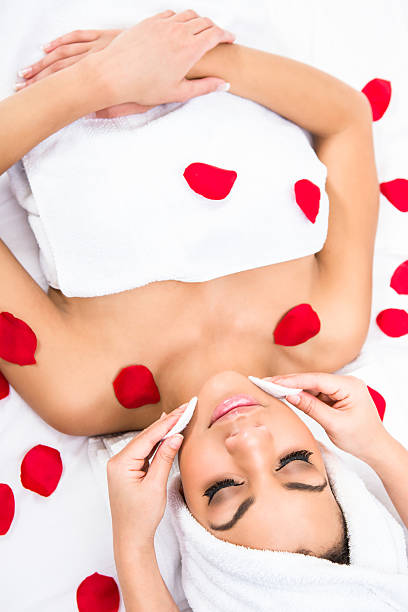 istock Woman at the spa with rose petals 495660546