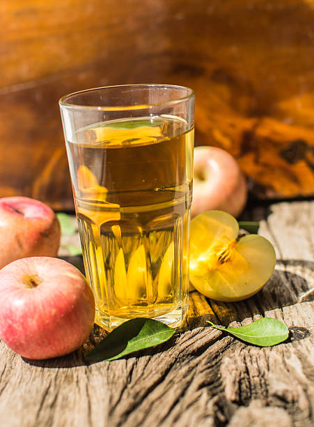 istock Apple juice on a wooden board 495660578