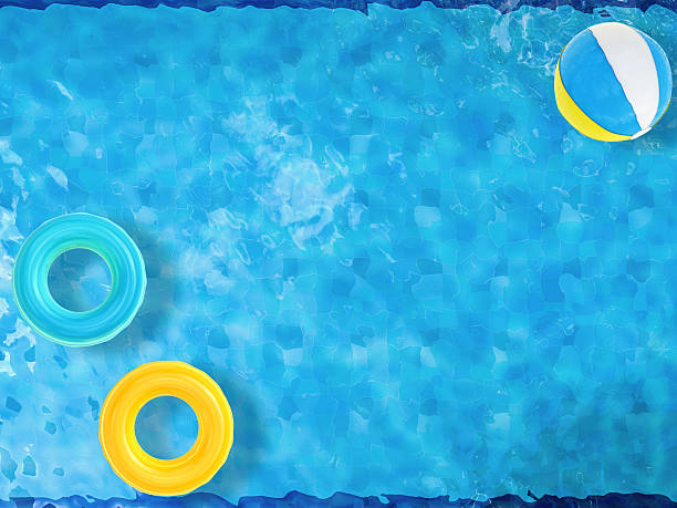 istock pool top view with swim rings and beach ball 495662010