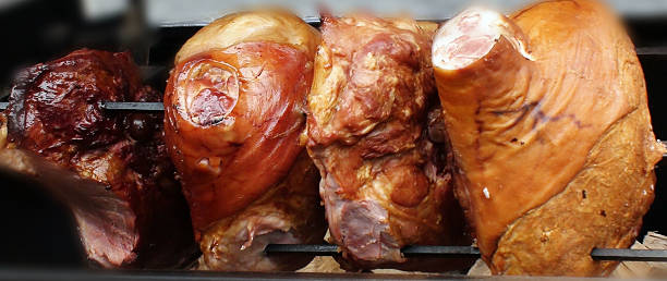 istock Large Piece Of Roasted Pig Spit On Fire 495662482