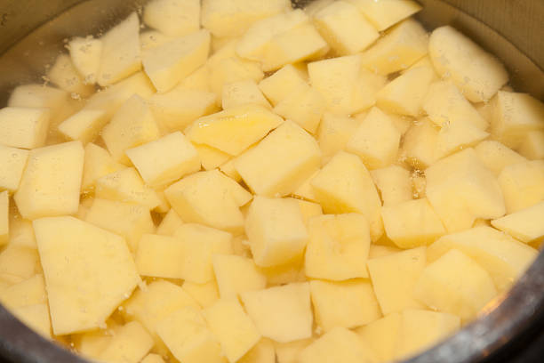 istock chopped potatoes underwater in pan 495662898