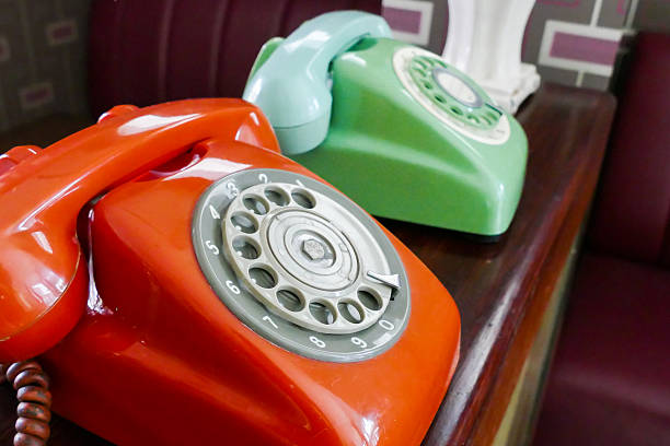 old dialling telephone old red, green dialling telephone for vintage style decoration dialling phone stock pictures, royalty-free photos & images