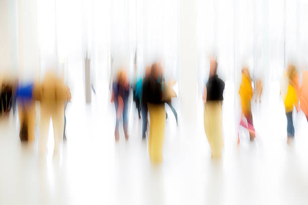 istock Group of Blurred People In Bright Lobby, Blurred Motion 495663670