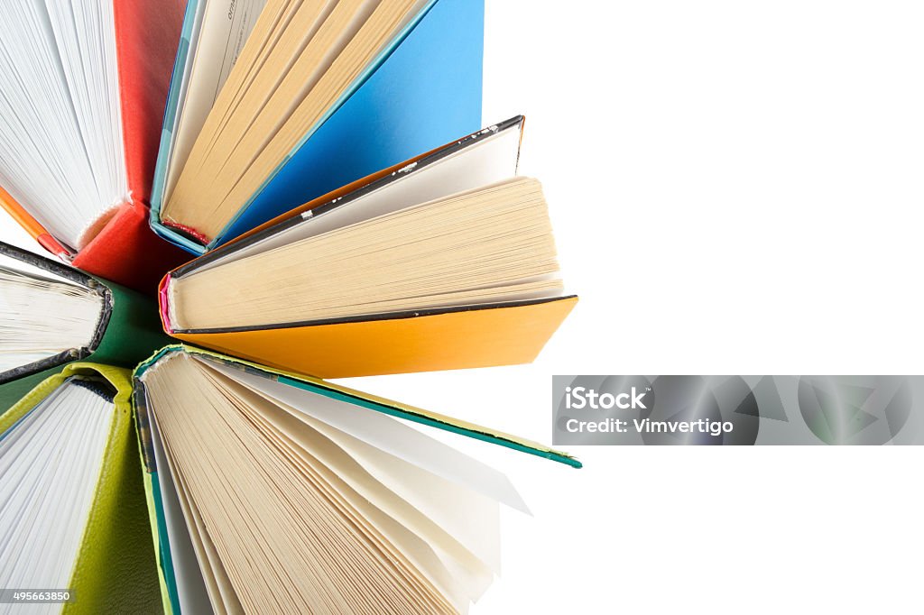 Top view of colorful hardback books in a circle. Top view of colorful hardback books in a circle isolated on white background. Back to school. 2015 Stock Photo