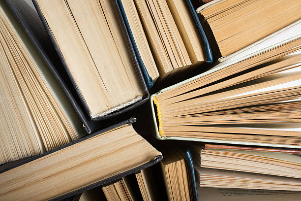 istock Top view of colorful hardback books in a circle. 495664008