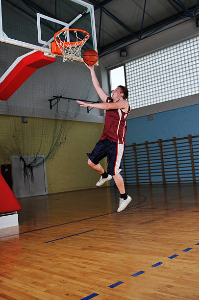 istock basket ball game player at sport hall 495665255