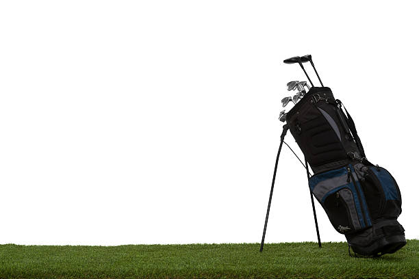 istock Golf bag and clubs on grass isolated on white 495665867