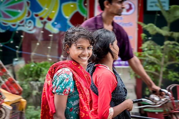 Dhaka, Bangladesh-July 10-2012: The photo was taken in Bangladesh capital Dhaka, in a downtown district where we can see many people walking around, we see people of Bangladesh always smiling