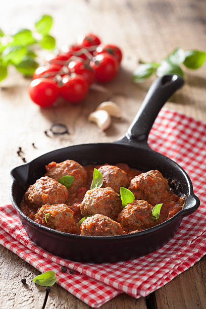 istock meatballs with tomato sauce in black pan 495667809