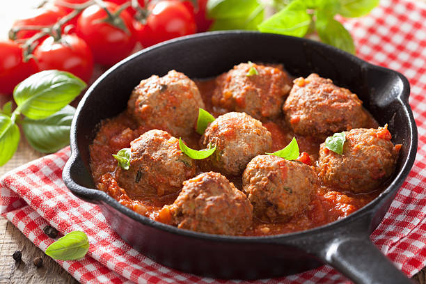 istock meatballs with tomato sauce in black pan 495667811