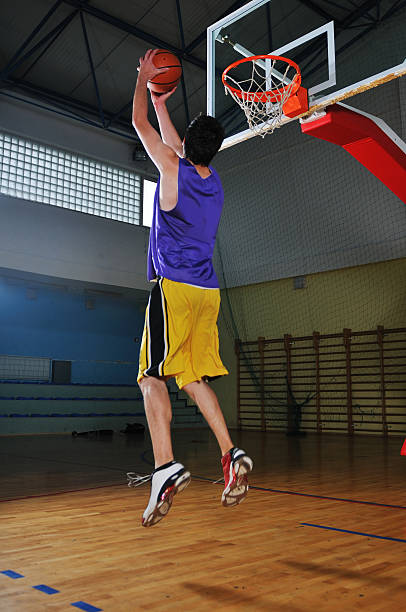 istock basket ball game player at sport hall 495667973