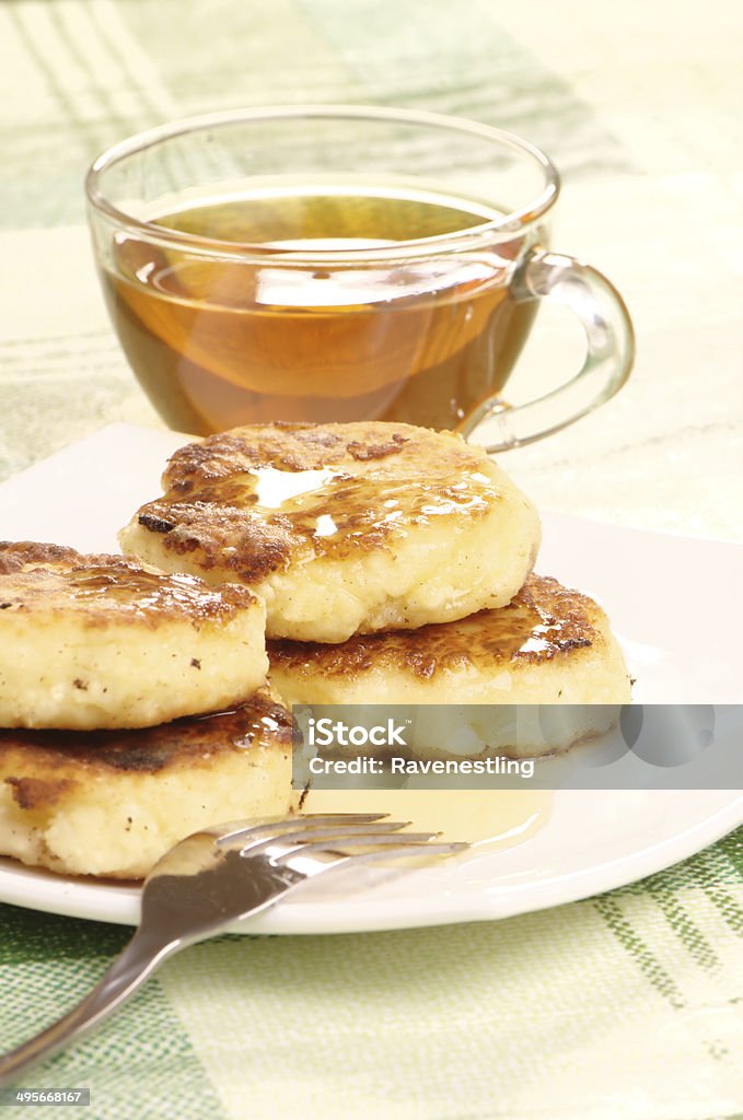 Delicious homemade cheese pancakes with honey Delicious homemade cheese pancakes with honey closeup Backgrounds Stock Photo