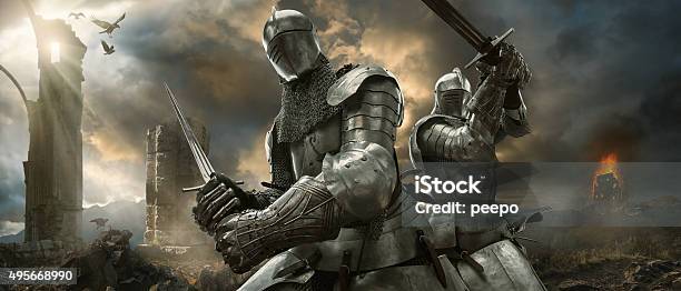 Two Medieval Knights With Swords On Battlefield Near Ruined Monuments Stock Photo - Download Image Now