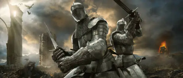 Photo of Two Medieval Knights With Swords On Battlefield Near Ruined Monuments