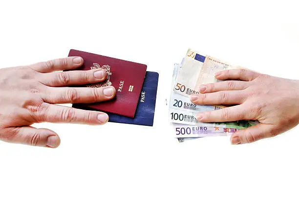 Photo of buying illegal foreign passport hands exchanging money and docum