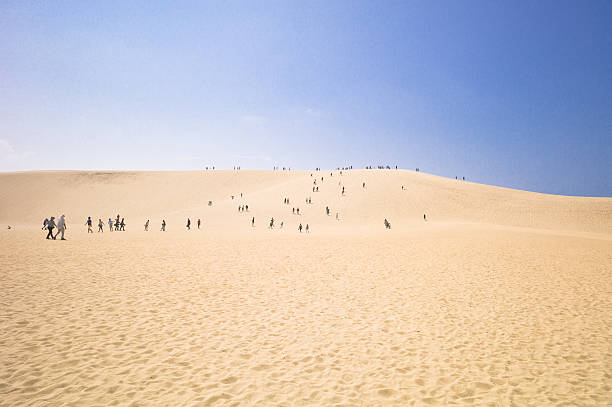 Tottori, Japan - July 21, 2014: People at the Tottori Sand Dunes in Tottori Prefecture, Japan. It is the only large dune system in Japan.