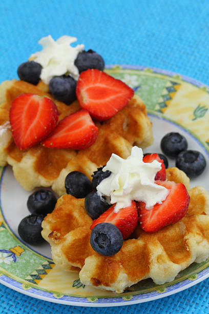 istock Wafers with strawberries, blueberries and whipped cream 495670809