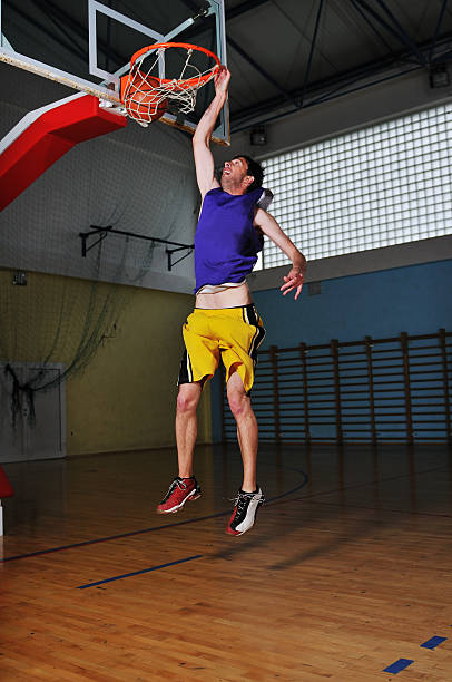 istock basket ball game player at sport hall 495671097