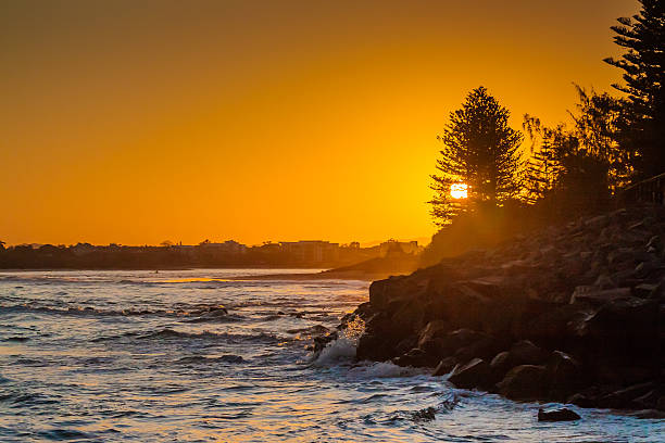 Sunset Over The Beach A beautiful sunset at the beach town of Caloundra in Queensland, Australia. caloundra stock pictures, royalty-free photos & images