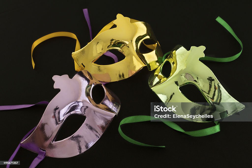Three carnival masks on dark background Black Color Stock Photo