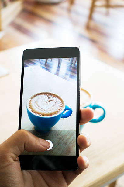 istock Hands taking photo coffee with smartphone 495671814