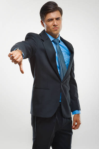 istock Businessman showing thumbs down sign on white background 495671944
