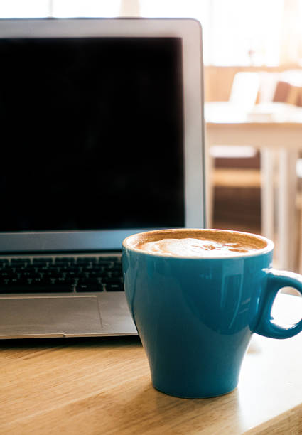 istock Laptop and coffee on desk 495672656