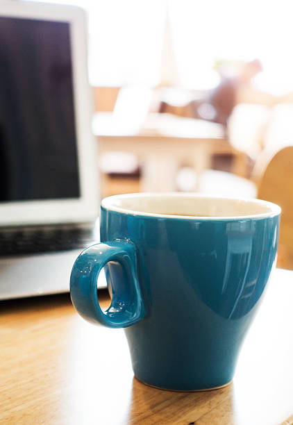 istock Laptop and coffee on desk 495673938