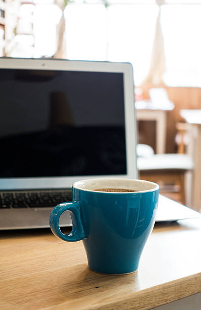 istock Laptop and coffee on desk 495674100