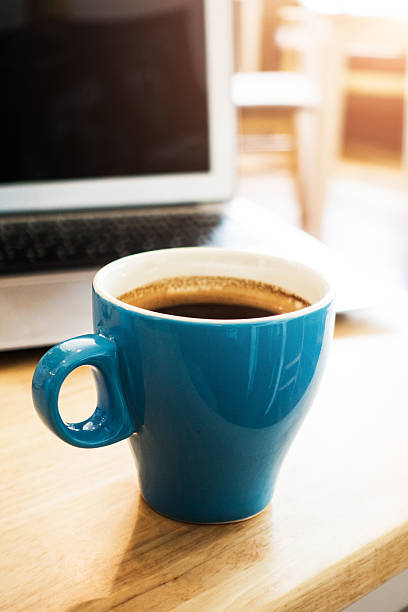 istock Laptop and coffee on desk 495674314