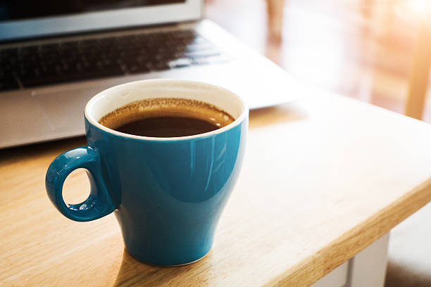 istock Laptop and coffee on desk 495674528