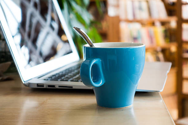 istock Laptop and coffee on desk 495674716