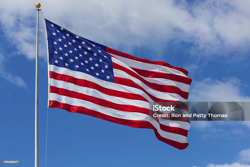 American flag against the sky American Flag Stock Photo