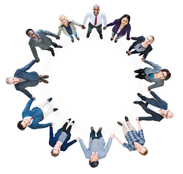 istock Cheerful Business People Holding Hands Forming a Circle 495687119