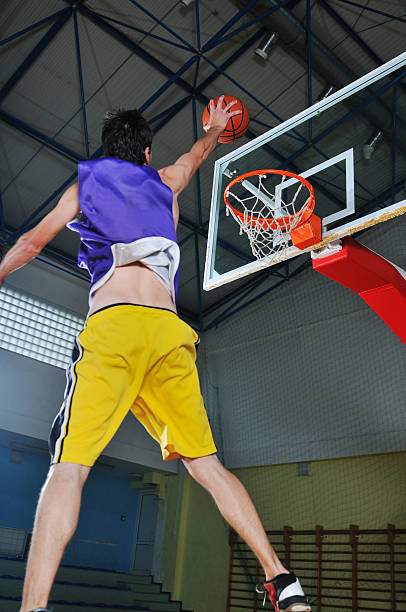 istock basket ball game player at sport hall 495687551