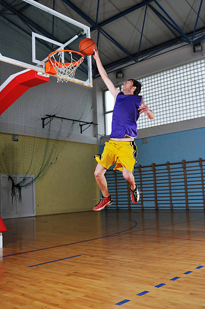 istock basket ball game player at sport hall 495687579