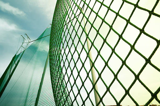 istock throw hammer protecting net on athletics field 495688951